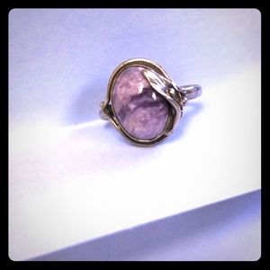 Purple swirled stone in silver setting. Size 9.5.